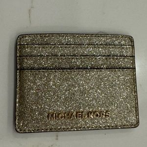 Michael lors card holder in very good condition gold with sparkles.